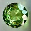 0.38 carat natural demantoid garnet from Namibia, bright green color and beautiful clarity.