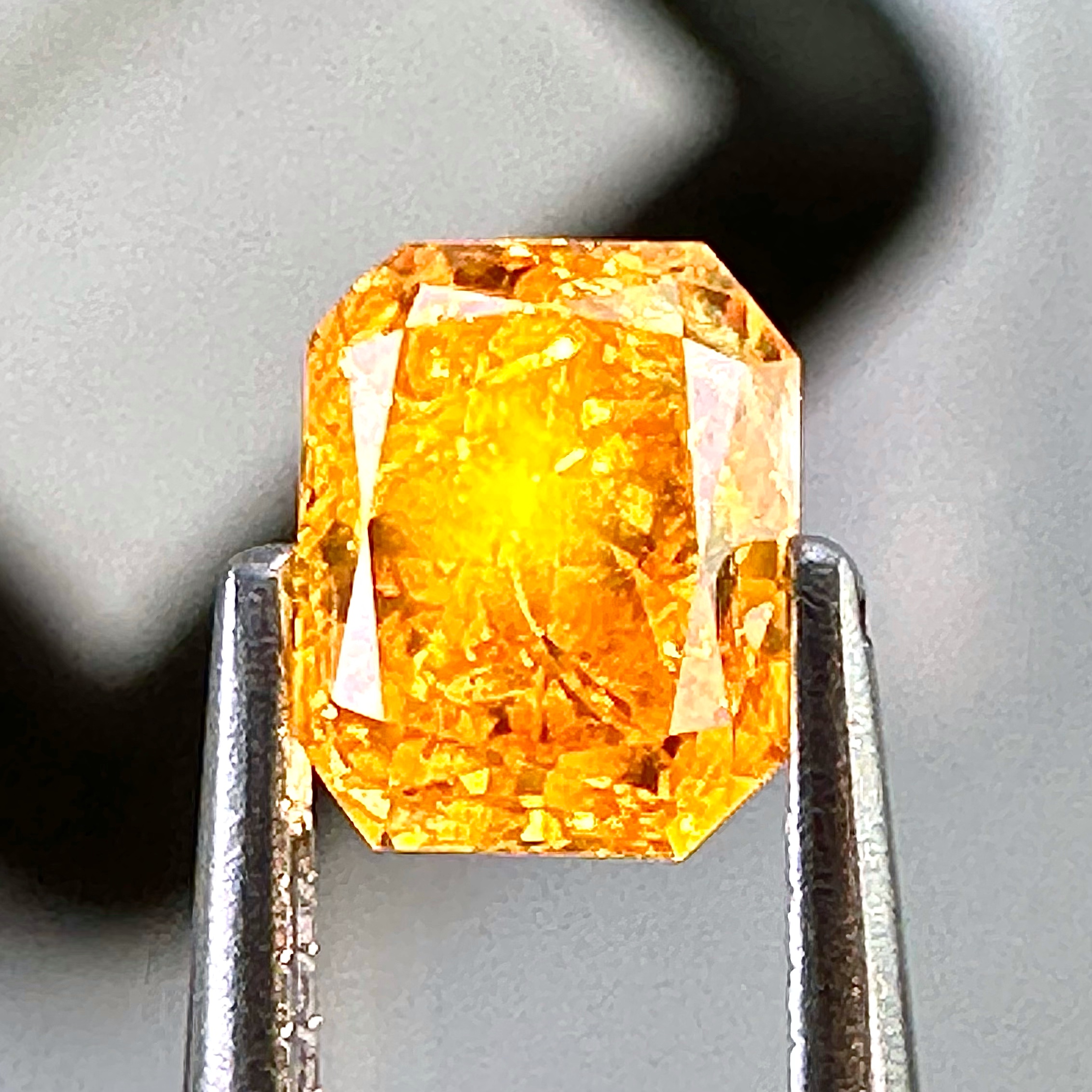 Yellow diamond under light