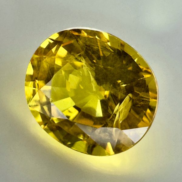 Tanzanian yellow sapphire exhibiting a luminous golden color and beautiful clarity