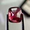 Natural cushion cut red spinel from Burma, exhibiting a rare raspberry color and excellent clarity, ideal for fine jewelry and gemstone collections.