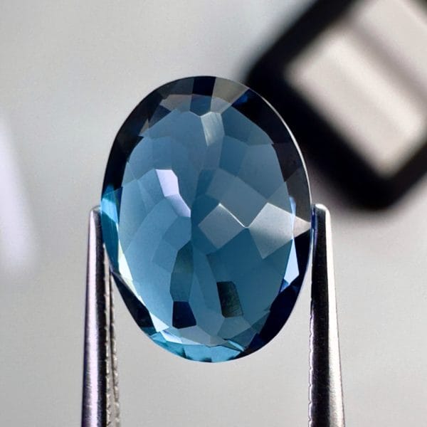 High quality 3.22ct oval shaped London Blue Topaz with a deep blue hue, luminous brilliance and excellent clarity - perfect for fine jewelry designs.