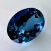 High quality 3.22ct oval shaped London Blue Topaz with a deep blue hue, luminous brilliance and excellent clarity - perfect for fine jewelry designs.