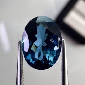 High quality 3.22ct oval shaped London Blue Topaz with a deep blue hue, luminous brilliance and excellent clarity - perfect for fine jewelry designs.