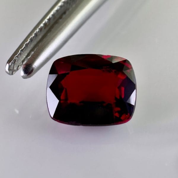 1.58 carat red spinel, cushion shape, Burmese origin, excellent clarity